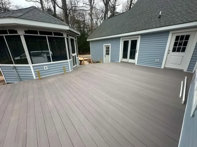 Finished composite deck beside the screened gazebo