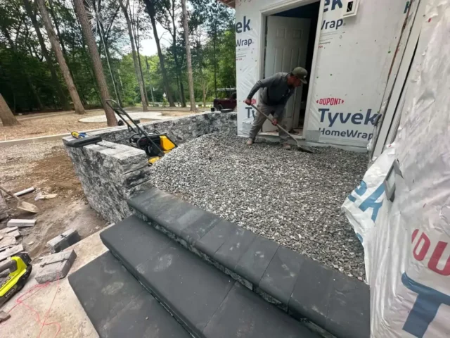 Stone steps and a gravel landing being built