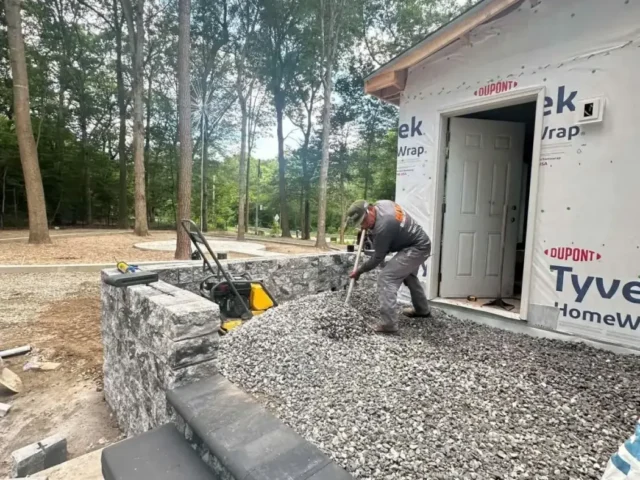 Stone steps and retaining wall at the entry