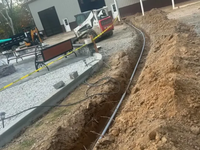 Utility trench running to the pole building