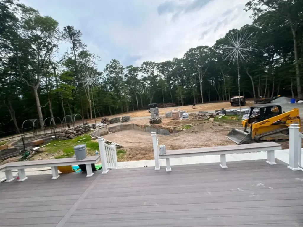 Track loader working in the yard, seen from the new deck