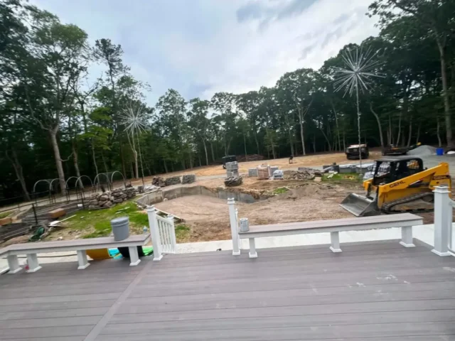 Track loader working in the yard, seen from the new deck